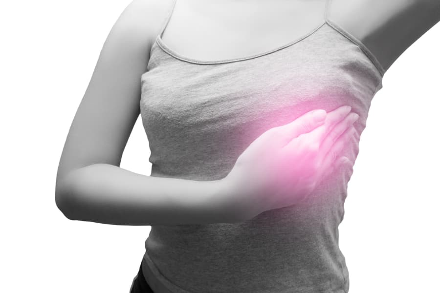 Person performing self-examination for breast cancer