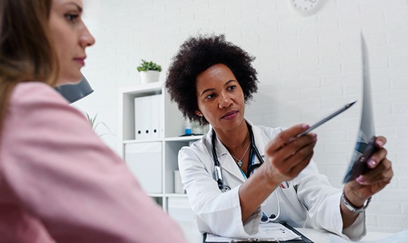 Physician discusses prostate cancer treatment options with patient