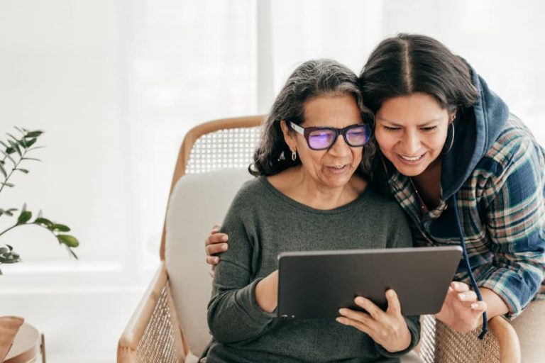 Patient and family member looking at a tablet together