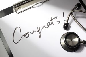 Congrats written on clipboard paper with stethoscope