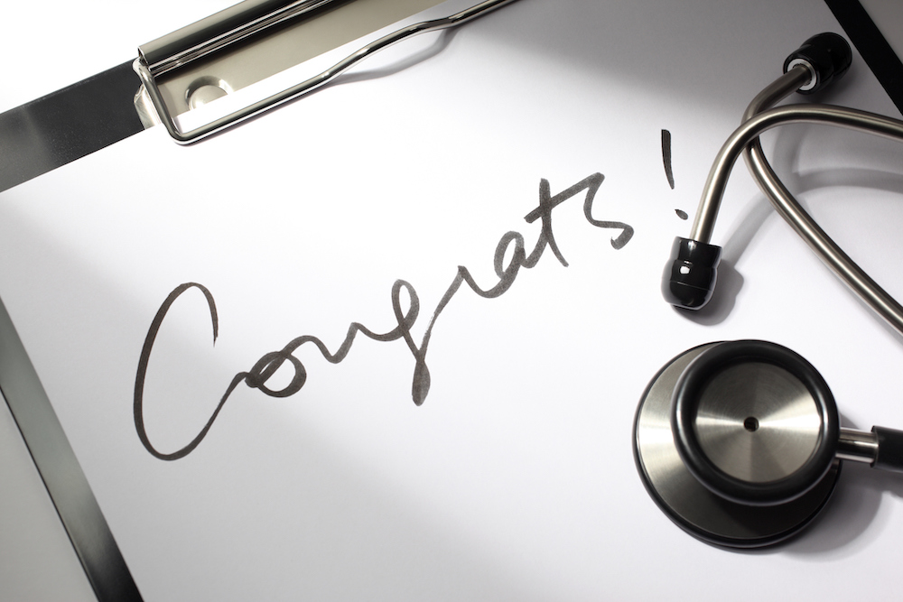 Congrats written on clipboard paper with stethoscope