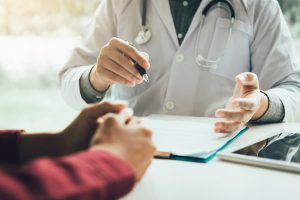 Doctor talking to patient and discussing treatment options