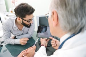 Oncologist discussing lung scan with patient