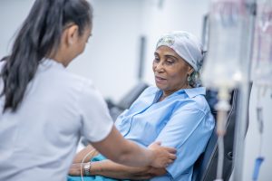 Oncologist speaks with patient with cancer