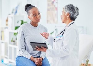 Doctor consulting patient about breast cancer risks