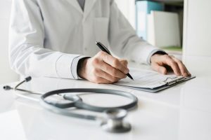 Doctor reviewing prostate biopsy report