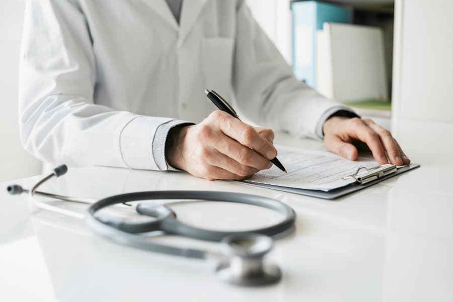 Doctor reviewing prostate biopsy report