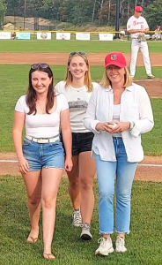 Dr. Hannah Yamin, hematologist and medical oncologist at RCCA, with volunteers at Cape Cod Baseball League game
