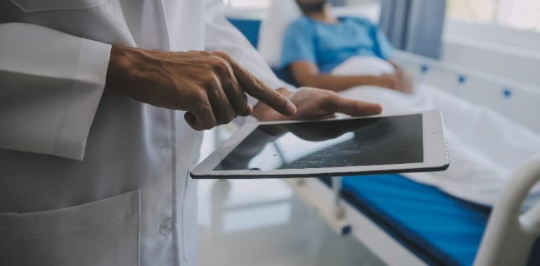 physician explaining prostate examination to patient