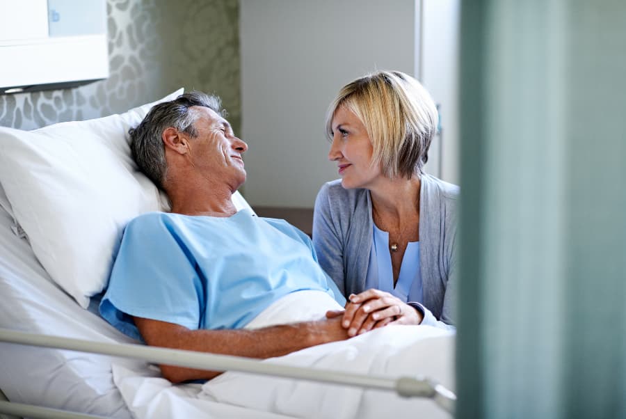 Patient and family member visiting in hospital after surgery