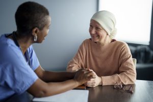 Nurse talking to cancer patient