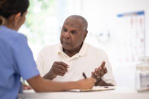 Nurse discusses next steps with prostate cancer patient