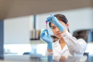 Laboratory worker analyzing blood sample