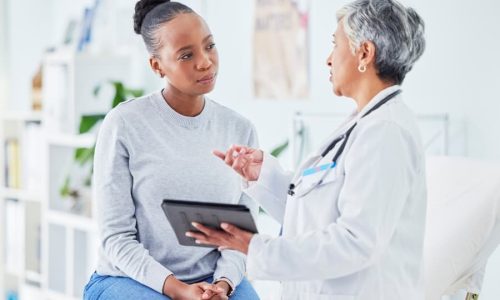 Doctor consulting patient about breast cancer risks