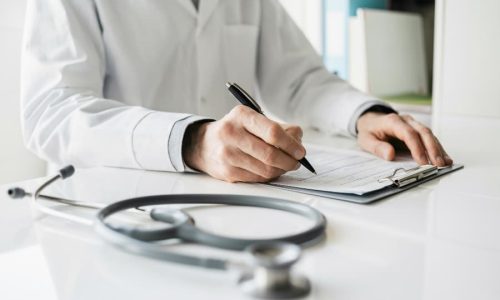 Doctor reviewing prostate biopsy report