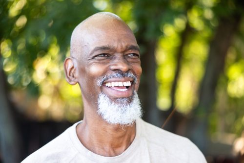 Prostate cancer patient smiling after treatment with radiopharmaceuticals